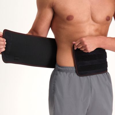 gladiator sports back support being put on